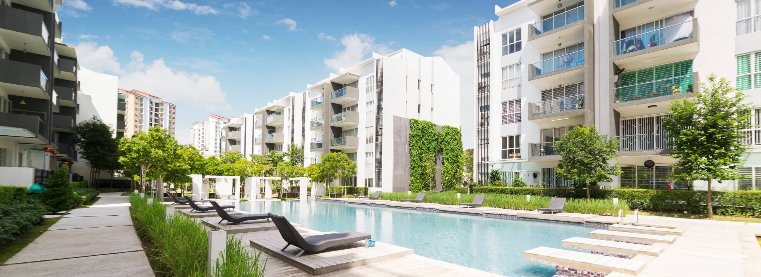 pool area surrounded by modern apartment buildings